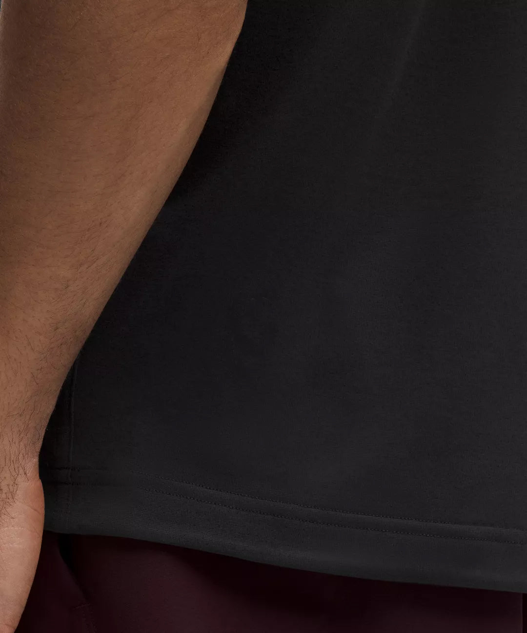 Close-Up of Natural Gas Men’s Black Performance Tank Hem – Lightweight Fabric Detail and Stitching