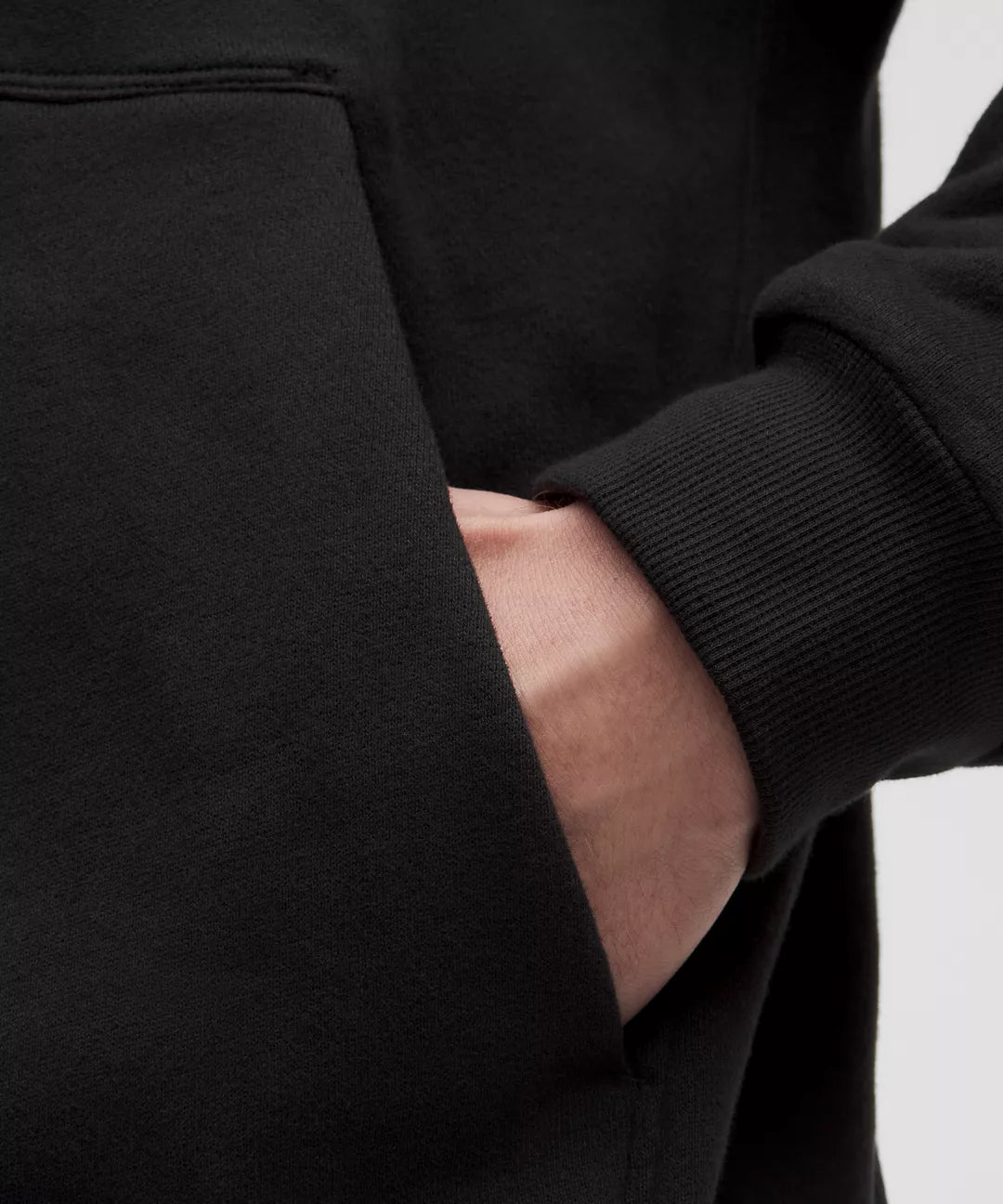 Close-Up of Natural Gas Men’s Black Hoodie Showing Kangaroo Pocket and Ribbed Cuff