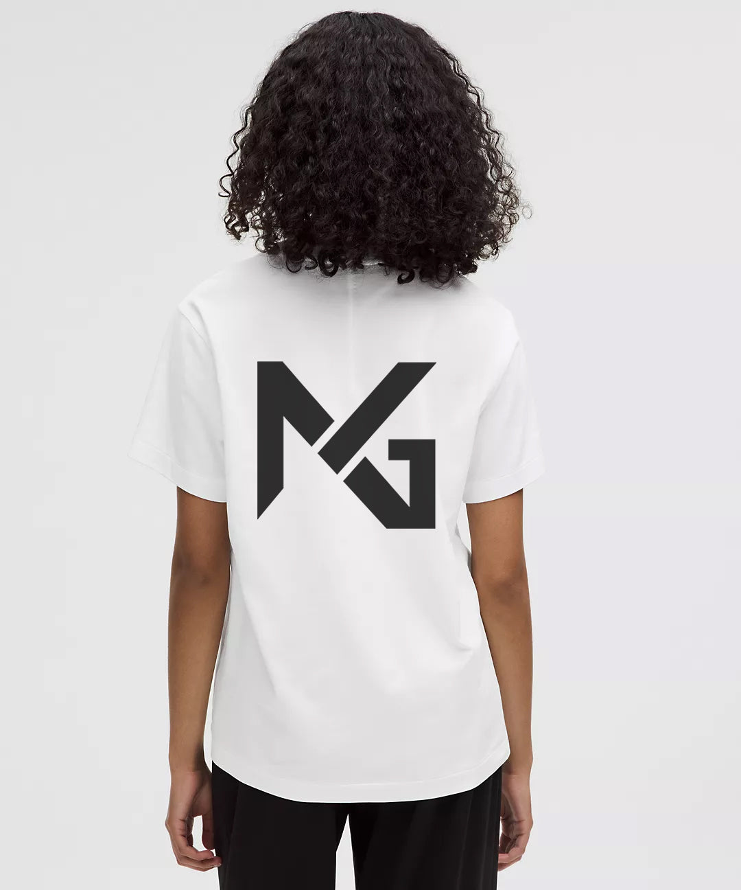 Woman Wearing White Natural Gas T-Shirt with Large Black NG Logo on Back – Clean Streetwear Design for Women’s Lifestyle and Fitness Apparel