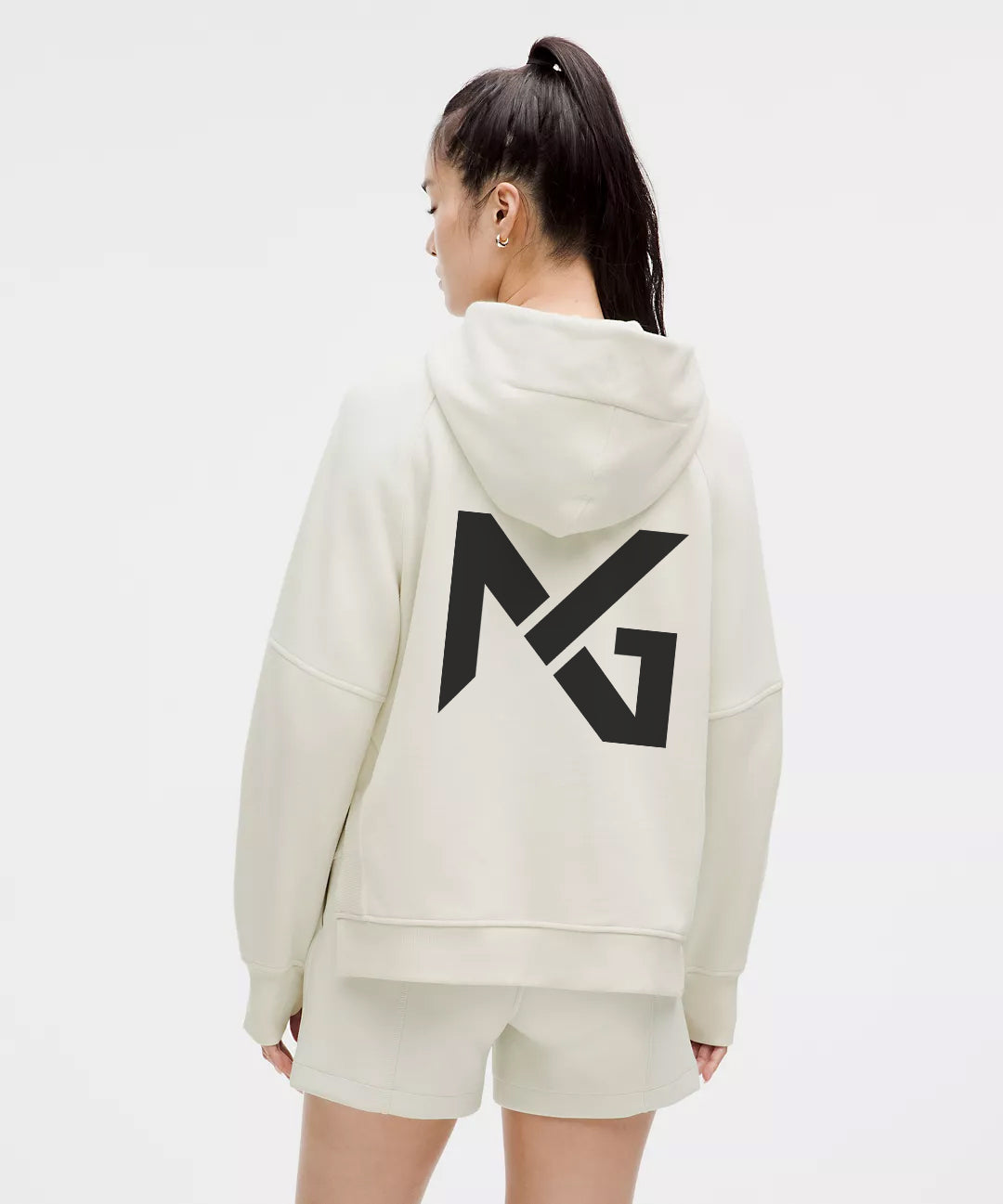 Back View of Woman Wearing Off-White Natural Gas Hoodie and Shorts – Oversized NG Logo on Back – Minimalist Streetwear Set for Women