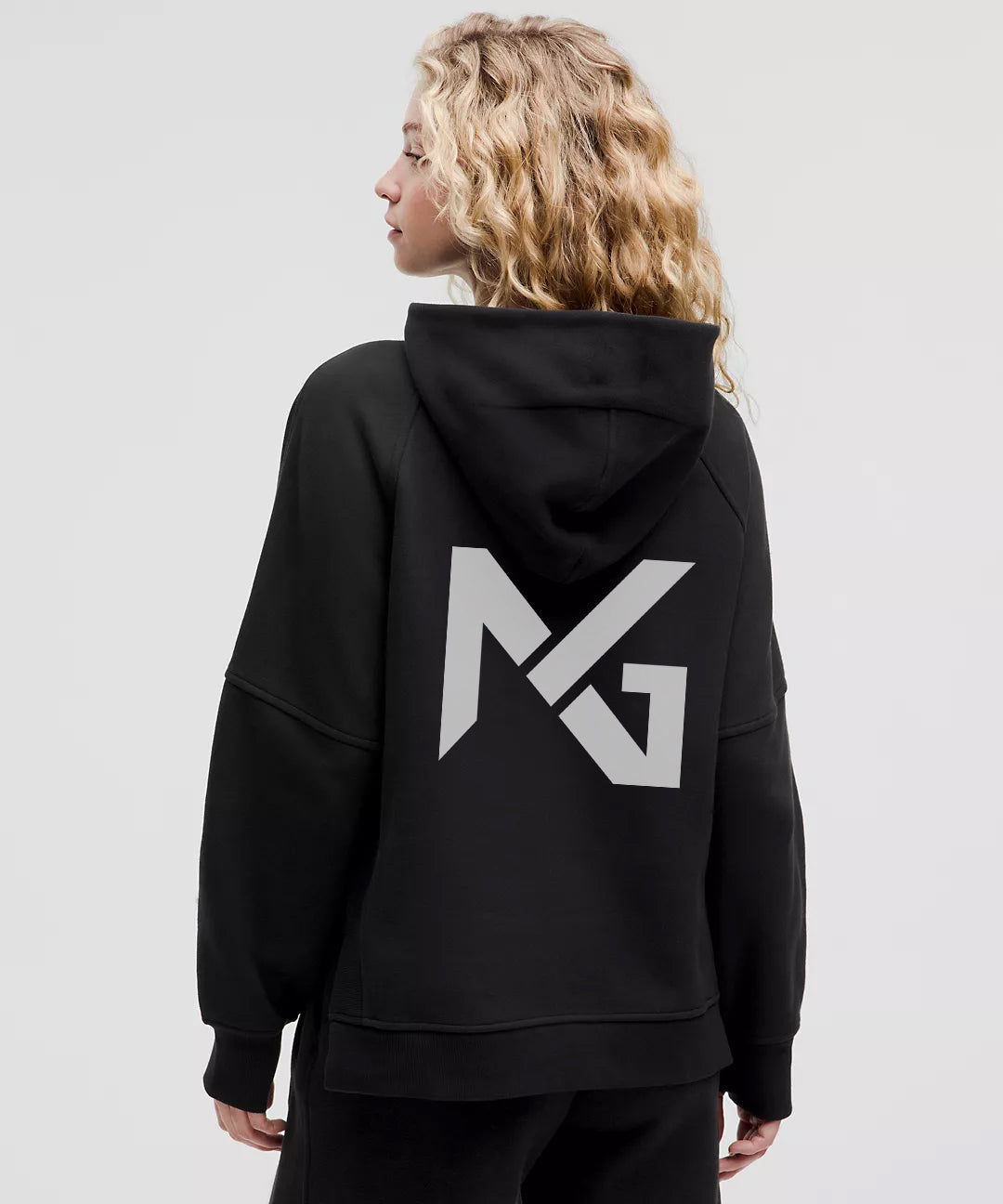 Back view of Natural Gas women's black hoodie featuring oversized NG logo on the hood, designed for a bold athletic streetwear look.